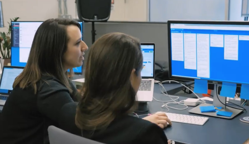 Two women working at a computer